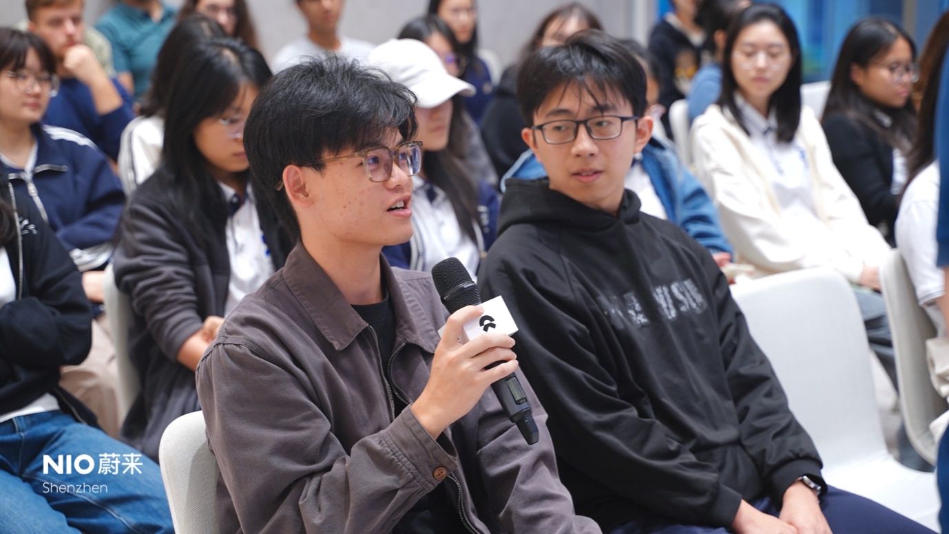 A person holding a microphoneAI-generated content may be incorrect.